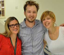 Paul Cuffee Librarians Megan Madden (left) and Leah Lubman (right) welcome Adam Gidwitz to Paul Cuffee School. 