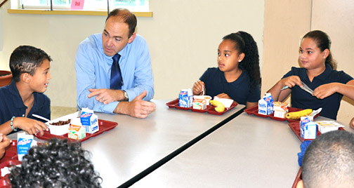 Head of School, Chris Haskins, breakfasts with 5th graders, Carlos Alfaia, Yanexa Almonte and Madel Cabreja on the first day of school